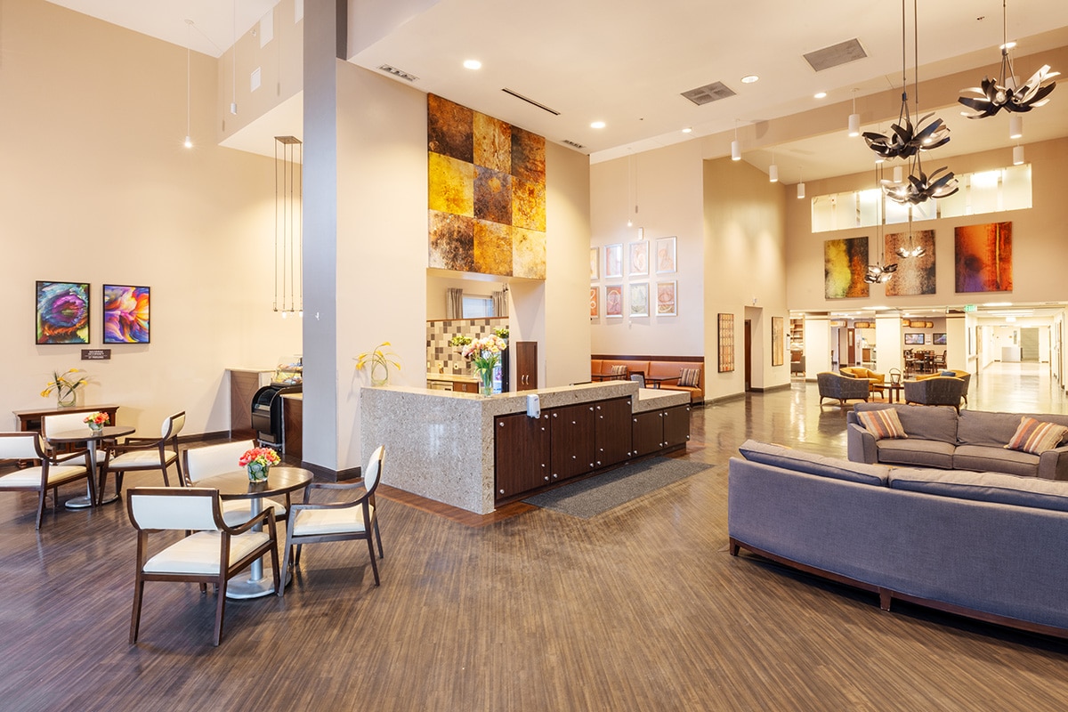 Large dining area with tables, sofas and snack bar