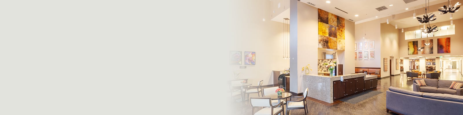 The front reception and lobby area with soft seating and high ceilings at Coal Creek Post Acute